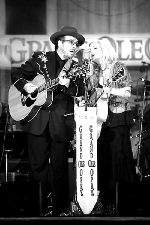 Elvis Costello and Emmylou Harris playing at the Grand Ole Opry