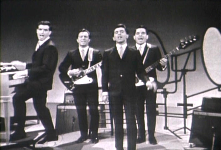 The Four Seasons, with Frankie Valli as the lead singer, Bob Gaudio on keyboards and tenor vocals, Tommy DeVito on lead guitar and baritone vocals and Nick Massi on bass guitar and bass vocals