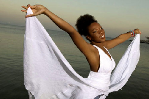 India.Arie's beautiful brown skin, shown off nicely by the pretty white dress