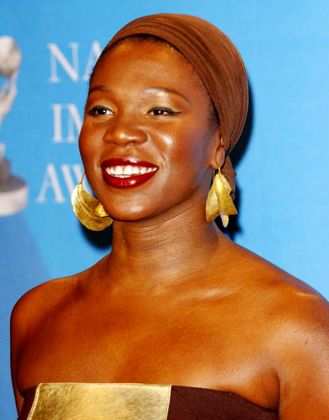 India Arie Simpson and her beautiful brown skin and bare shoulders