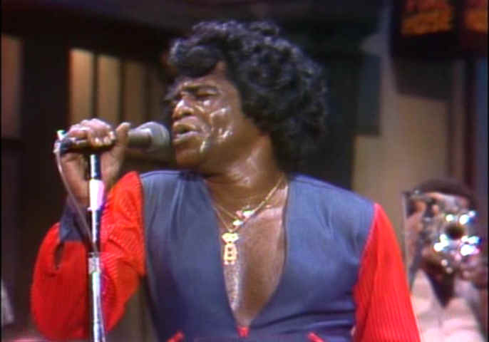 the Godfather of Soul on the mic