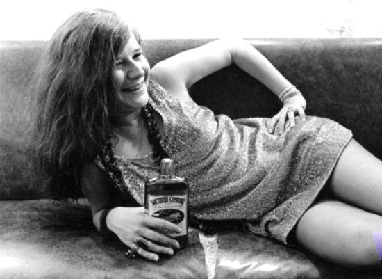 sexy drunk Janis Joplin with her favorite refreshment