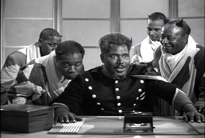 demon Louis Armstrong gauging his boss Lucifer Jr's reaction