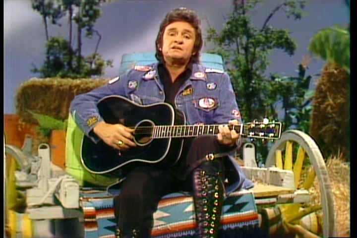 Johnny Cash on fake-y looking Hee Haw set