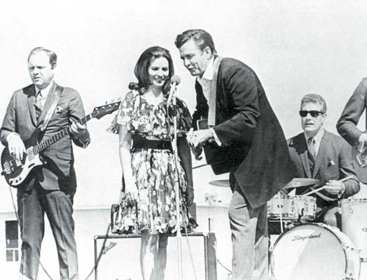 Young Johnny Cash and June Carter onstage