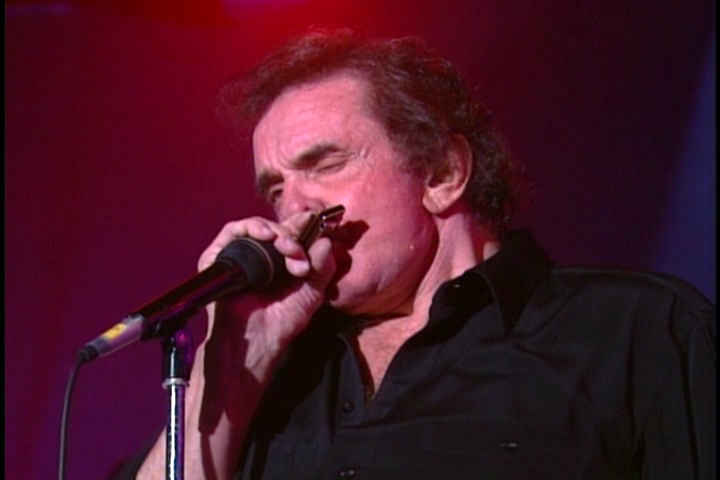 Johnny Cash playing harmonica