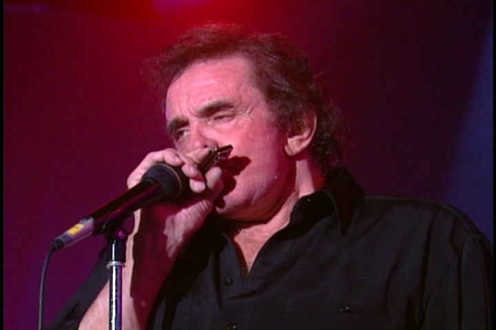 Johnny Cash blowing harmonica