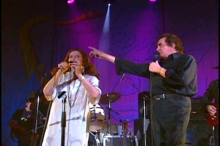 Johnny Cash and June Carter on stage