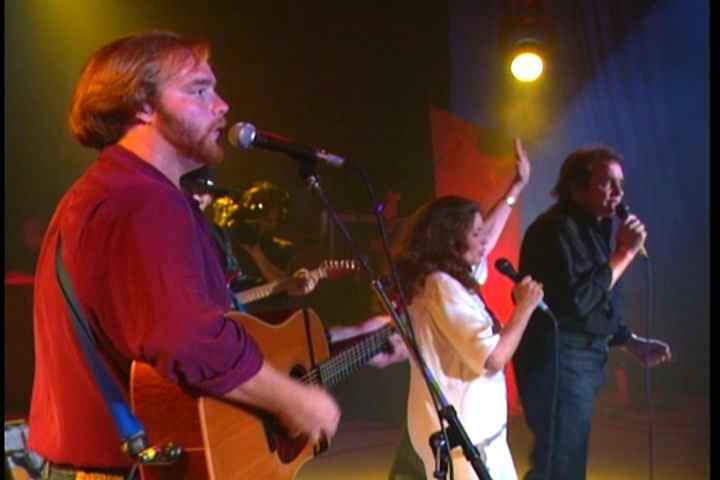 John Cash Jr onstage with ma and pa