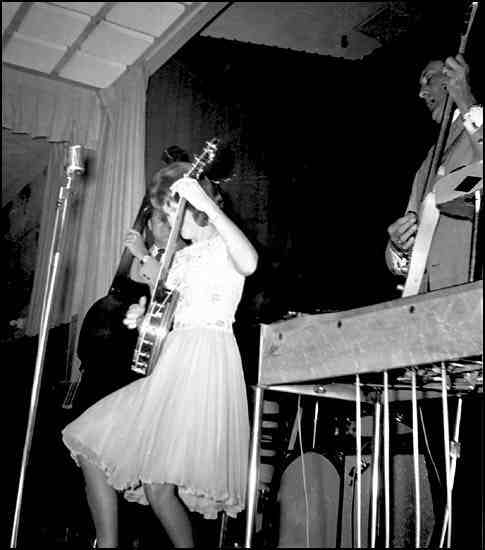 Young June Carter playing banjo onstage