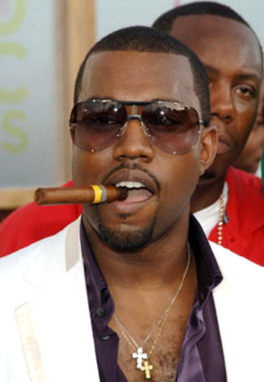 Kanye West - the mogul enjoys a cigar