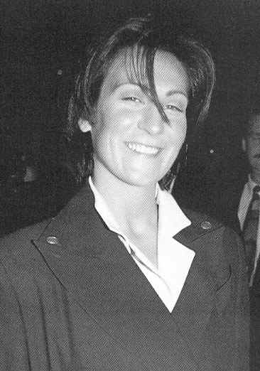 KD Lang grinning like the Cheshire Cat