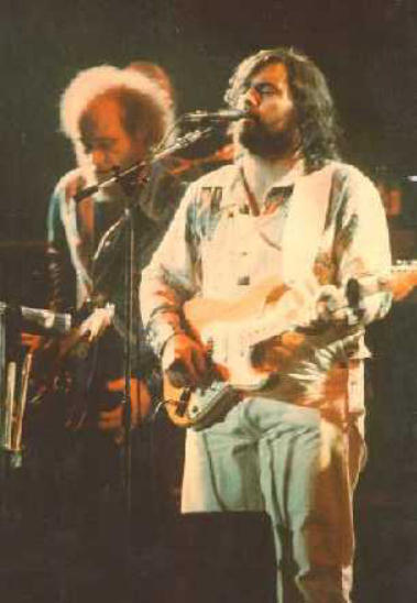 1979 photo of Lowell George playing guitar on stage with Little Feat