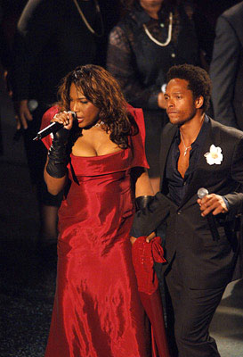 Macy Gray in a red dress