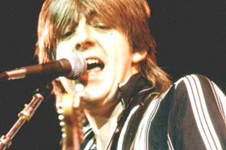 handsome young Nick Lowe on stage