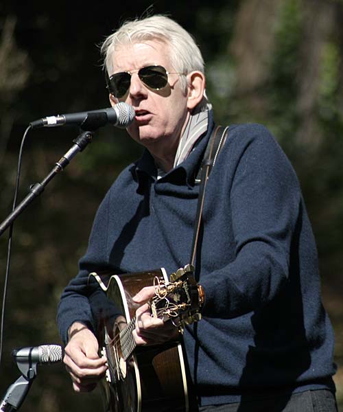 mature Nick Lowe on stage