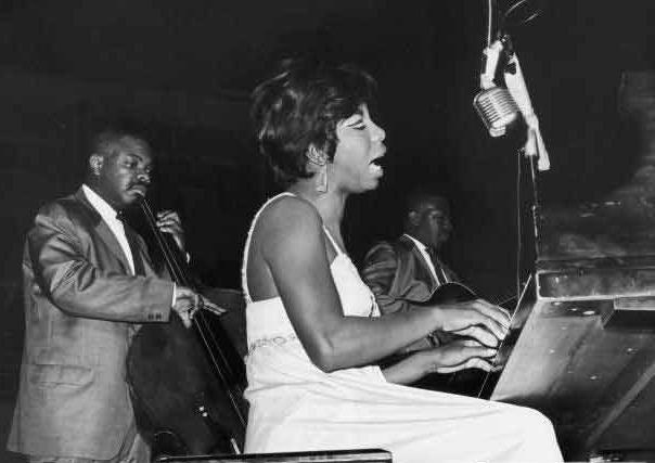 Nina Simone with a band on stage