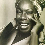 an unusually happy image of Nina Simone
