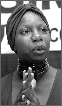 Nina Simone with her hands clasped together