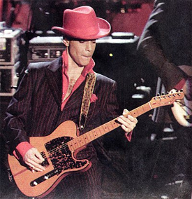 Prince Rogers Nelson playing guitar onstage