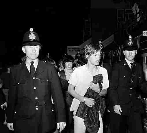 Mick Jagger and the Rolling Stones with police escort