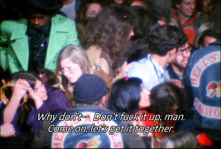 Meredith Hunter in the lime green suit in a crowd shot at December 6, 1969 Altamont Music Festival a minute or two before drawing a gun and being stabbed to death