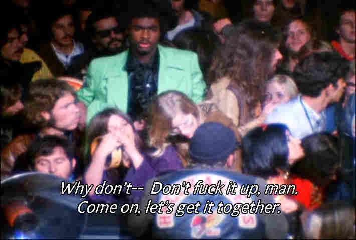 Meredith Hunter in the lime green suit in a crowd shot at December 6, 1969 Altamont Music Festival a minute or two before drawing a gun and being stabbed to death