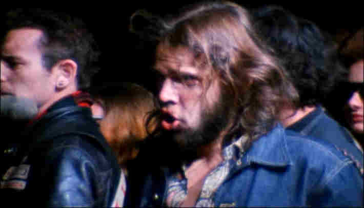 Rolling Stones fan freaking out on stage at Altamont, 1969