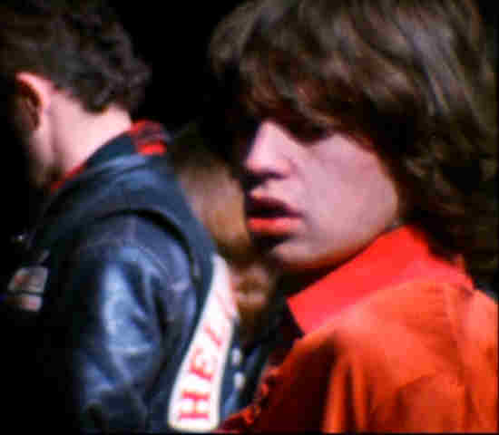 Mick Jagger watches as Hell's Angel Alan Passaro kills Meredith Hunter at Altamont Music Festival,  December 6, 1969
