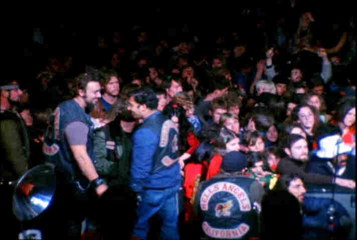 Two Hell's Angels look longingly into each other's eyes just after the killing of Meredith Hunter during the Rolling Stone's set at the 1969 Altamont Music Festival