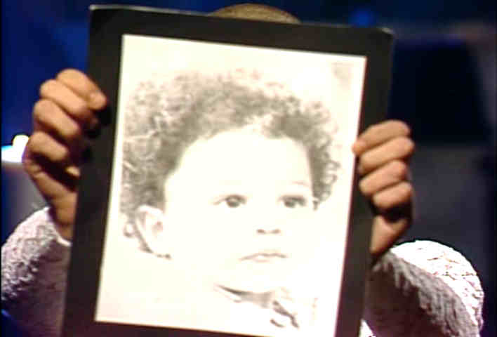 Sinead O'Connor holds up a picture of a child during a rehearsal for her 1992 SNL appearance.  On air, she instead pulled out a picture of the pope and rips it up