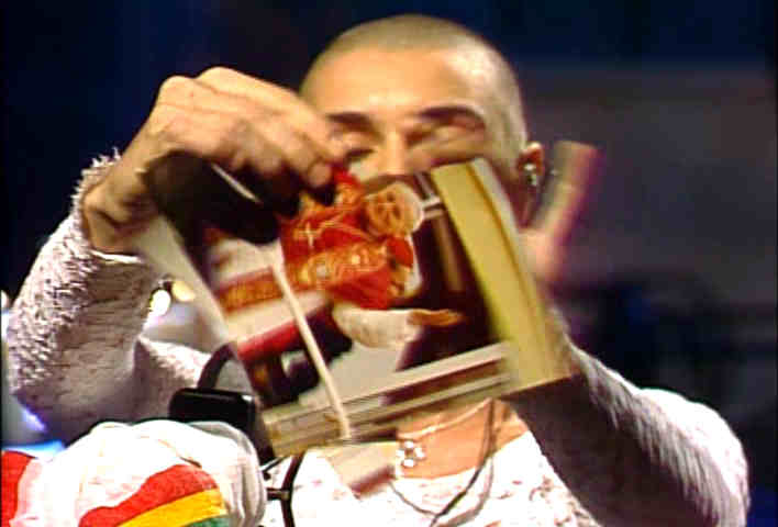 Sinead O'Connor tearing up a picture of the pope