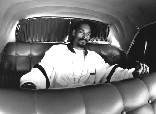 Calvin Broadus in the back of a car