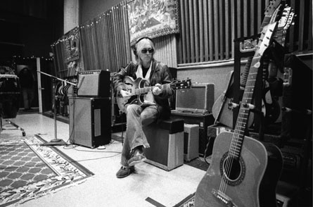Tom Petty playing guitar