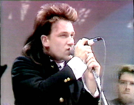 young Bono on the mic