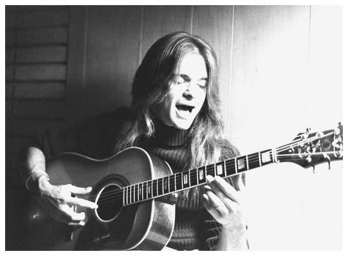 young David Lee Roth playing guitar