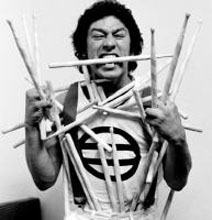 Alex Van Halen eating sticks