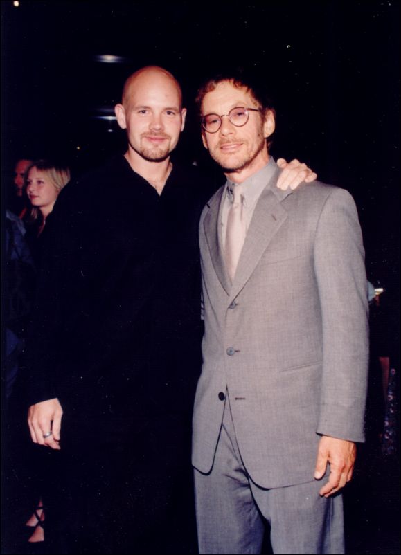 Warren Zevon looking right handsome in a gray suit and tie