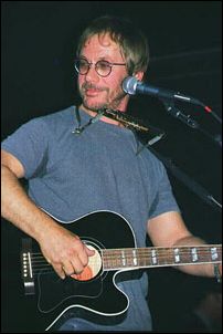 acoustic guitar, harmonica, and Warren Zevon