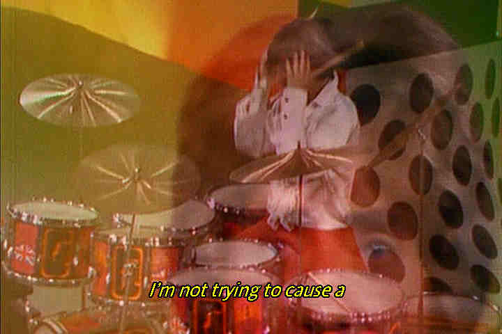 Keith Moon rubs his head mid-performance