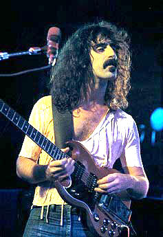 Frank Zappa playing guitar in concert