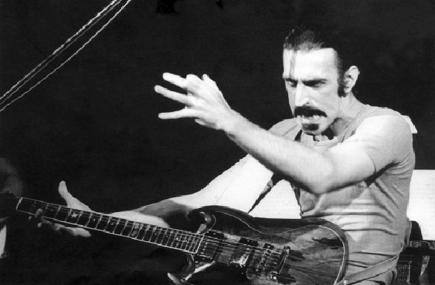 Frank Zappa gives a devil look mid guitar solo