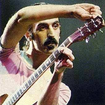 Frank Zappa tunes his guitar