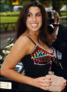 Amy Winehouse smiles for the camera